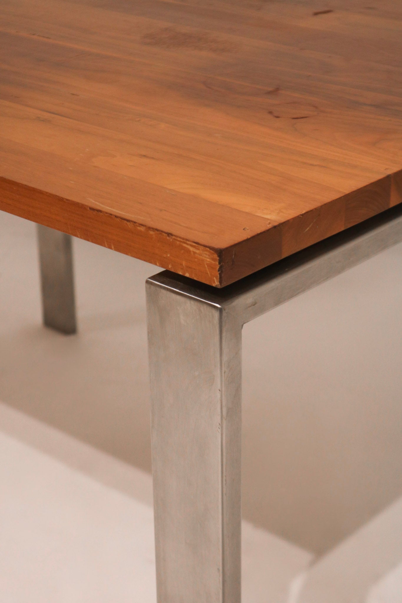 Zoomed view of one leg showing steel frame and light signs of wear near bottom