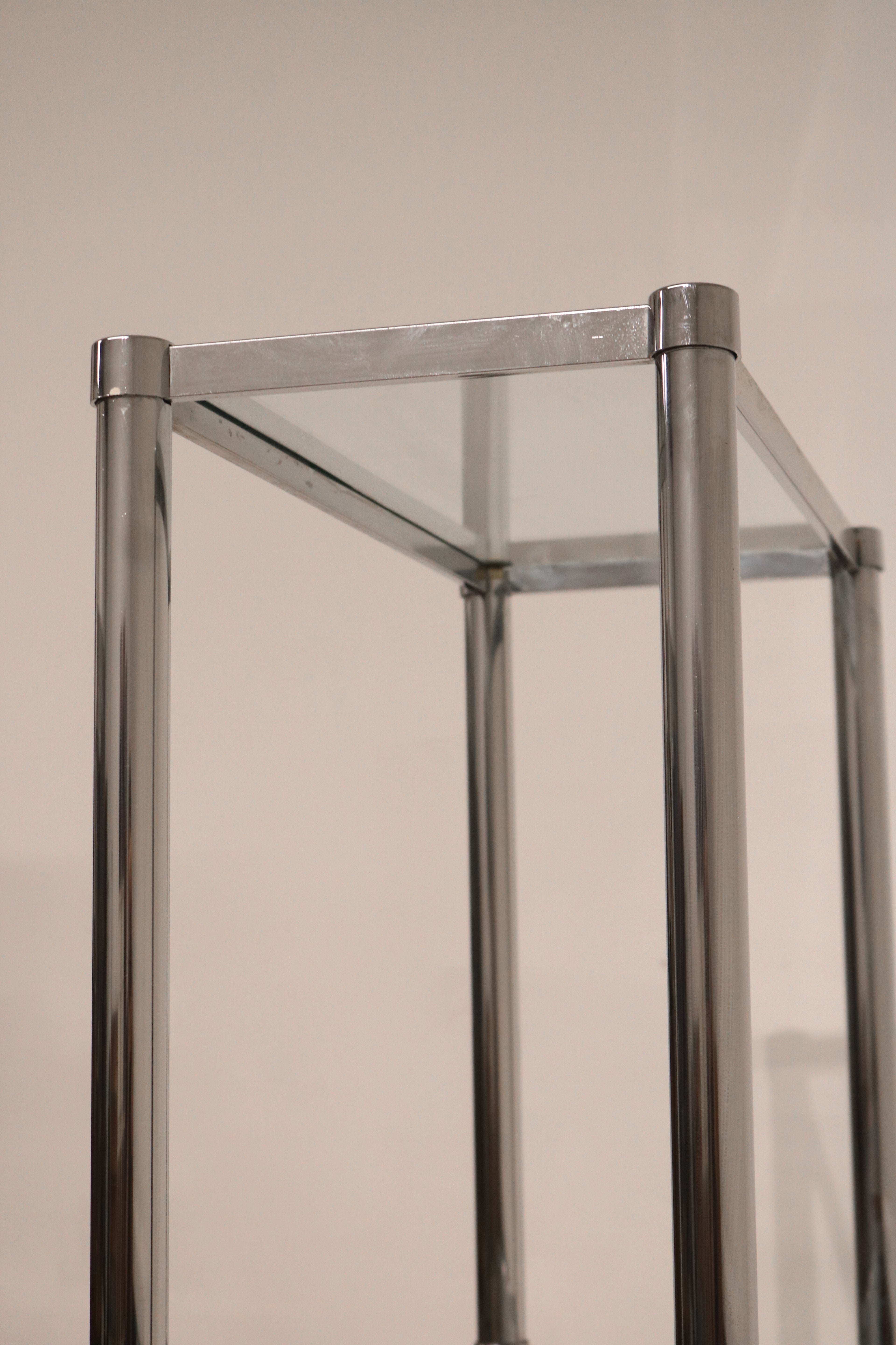 Base of the Vintage Chrome Steel Bookcase showing sturdy metal footing