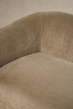 Detail of cushion edge and seam stitching on champagne velvet fabric, tailored seams and reinforced construction with slight wear at corner
