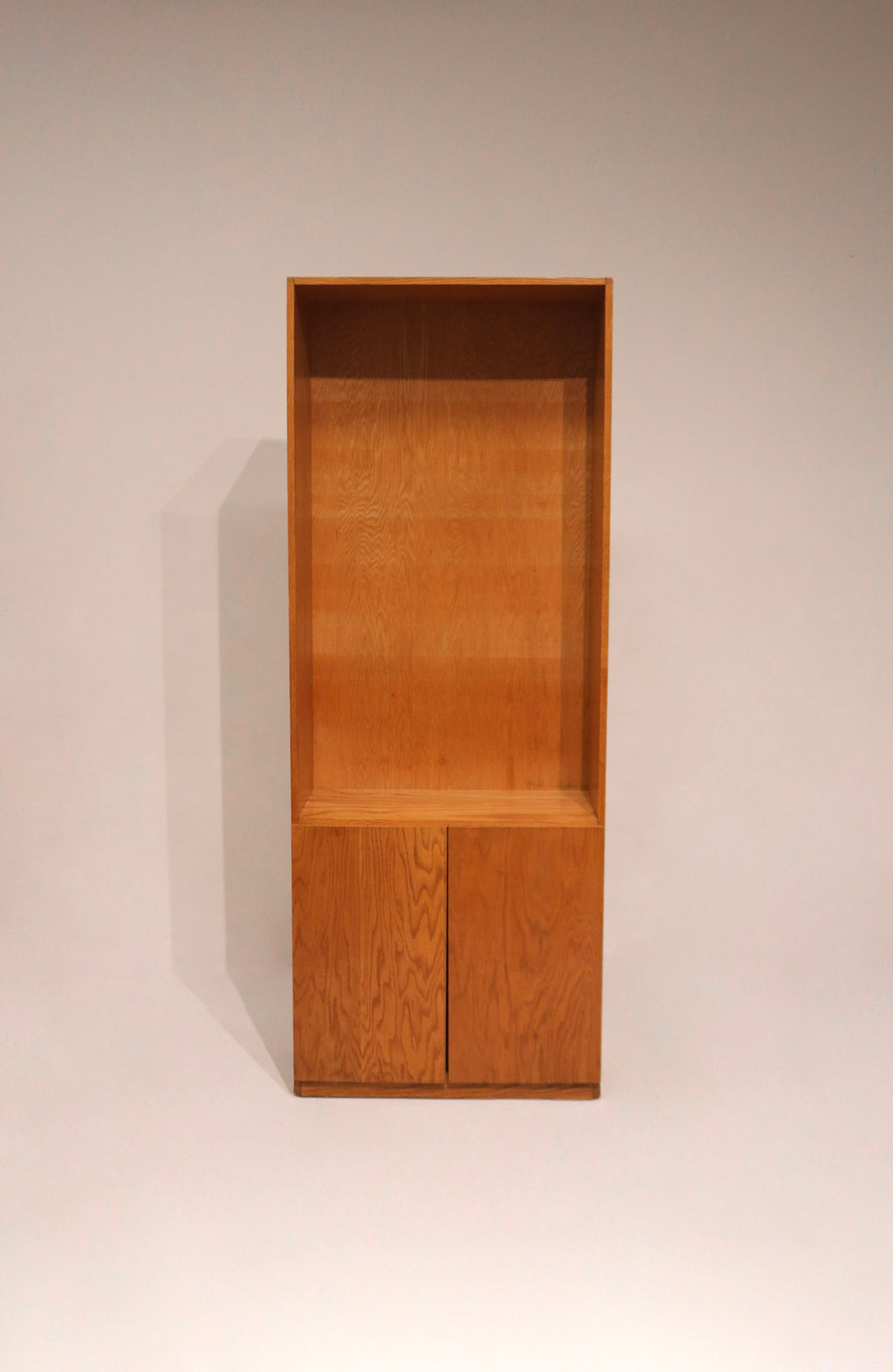 Image showing slight wear at bottom edge of oak bookcase with warm natural finish