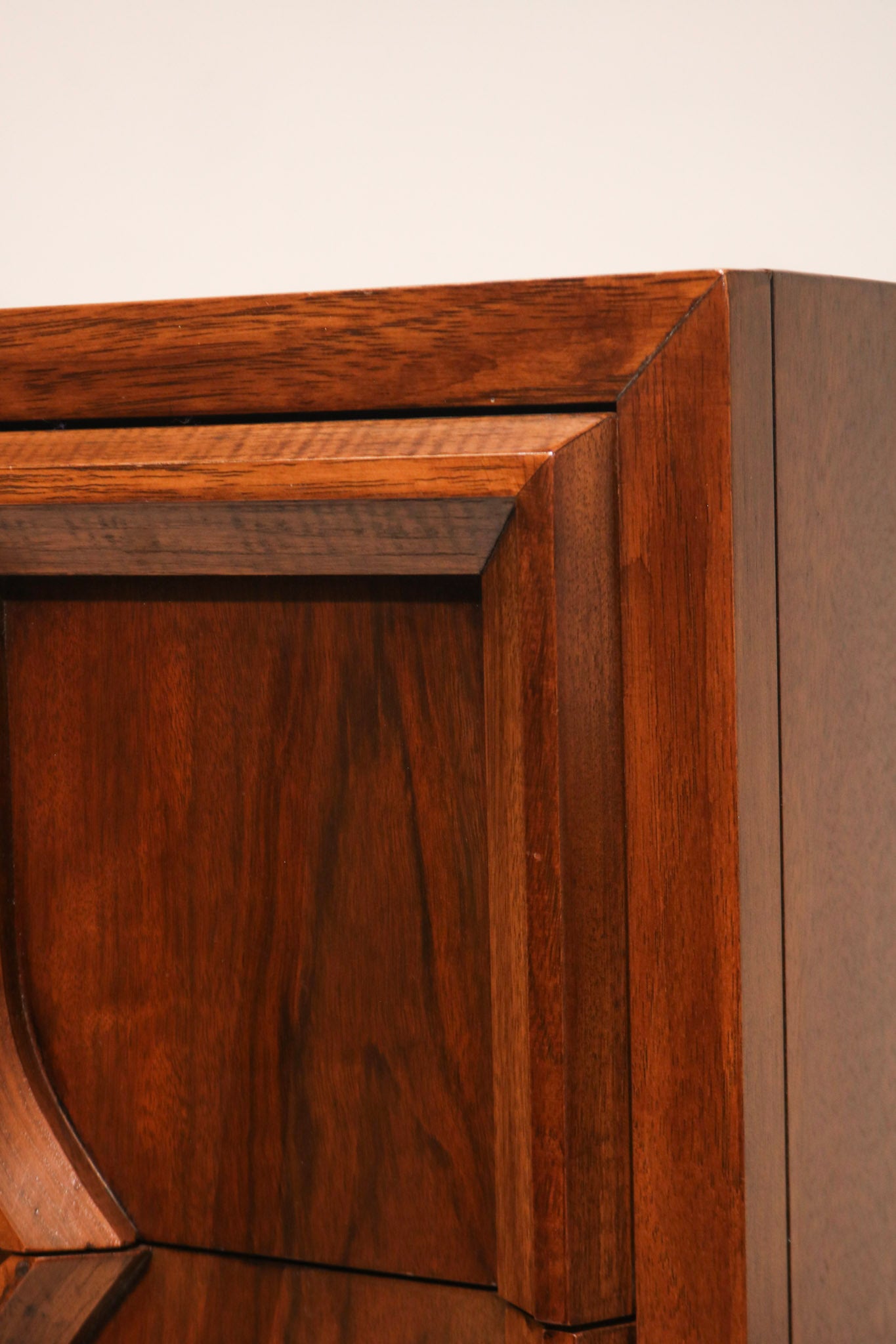 Angle shot highlighting the beveled edges and craftsmanship of 1960s walnut wood Highboy Dresser