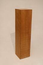 Close-up of oak wood texture on tall bookcase surface showing natural grain