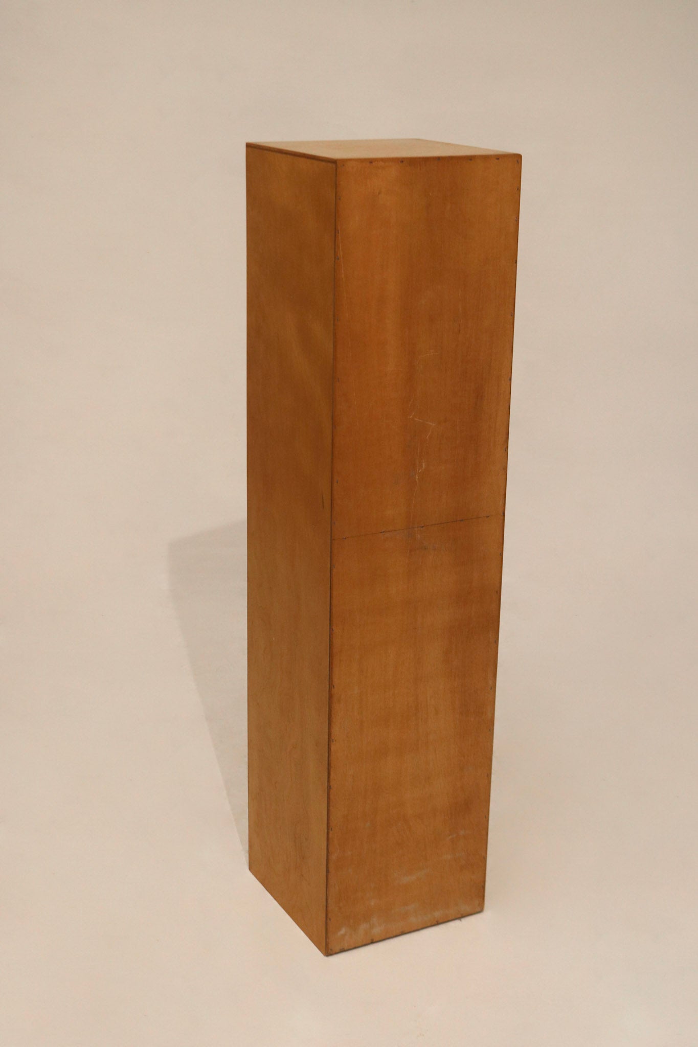 Close-up of oak wood texture on tall bookcase surface showing natural grain