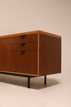 Front face of credenza, clearly displaying symmetrical design and walnut wood tones