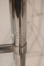 Side profile of Vintage Mcm Chrome Steel Bookcase displaying minimalist lines