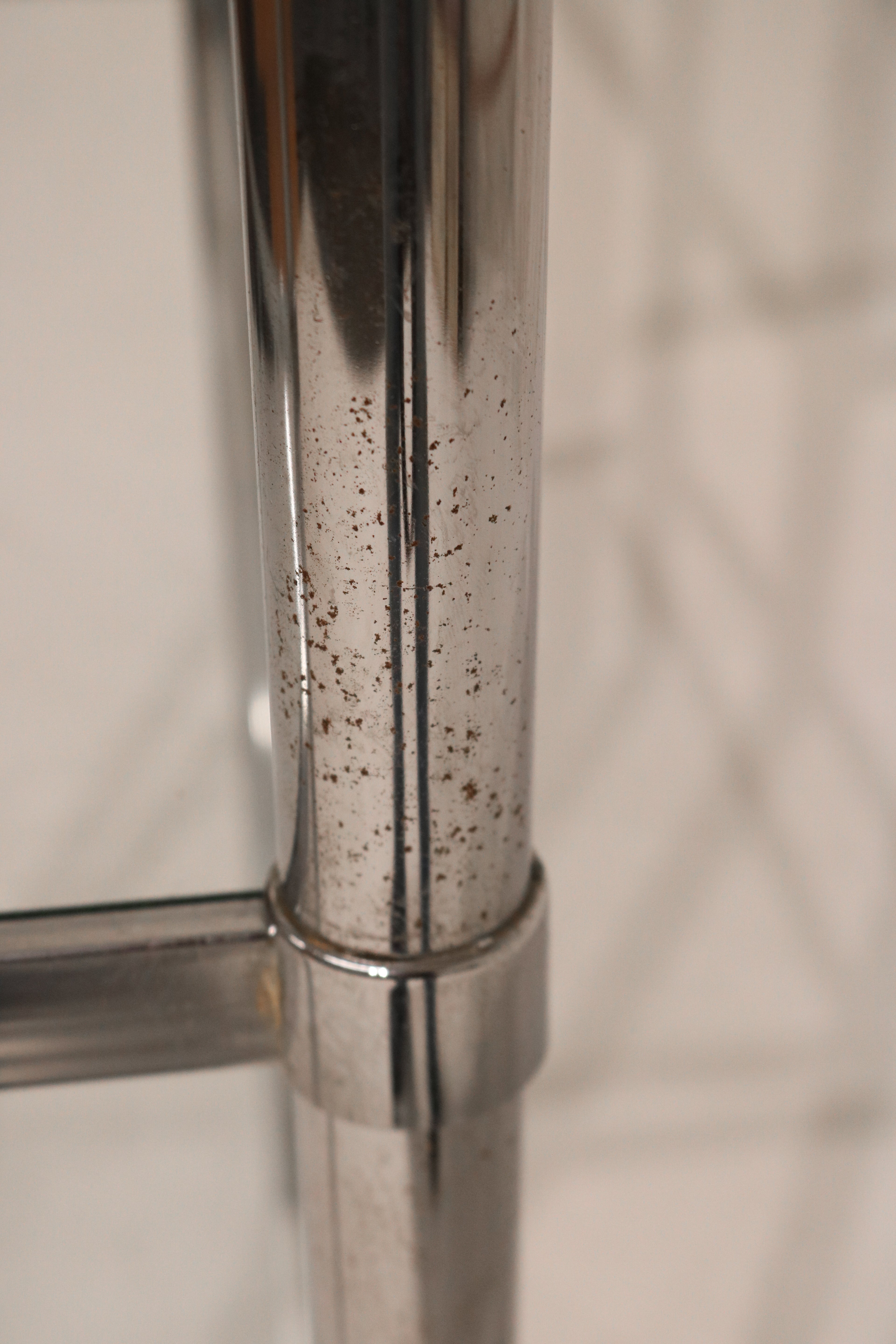 Side profile of Vintage Mcm Chrome Steel Bookcase displaying minimalist lines