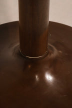 Angle view of dining table showing glossy wood texture and stylish round design