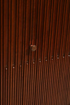 Detail of top drawer showing polished walnut wood and clean construction with smooth edges