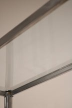 Close-up of metal surface showing minimal marks on Vintage Chrome Steel Bookcase frame