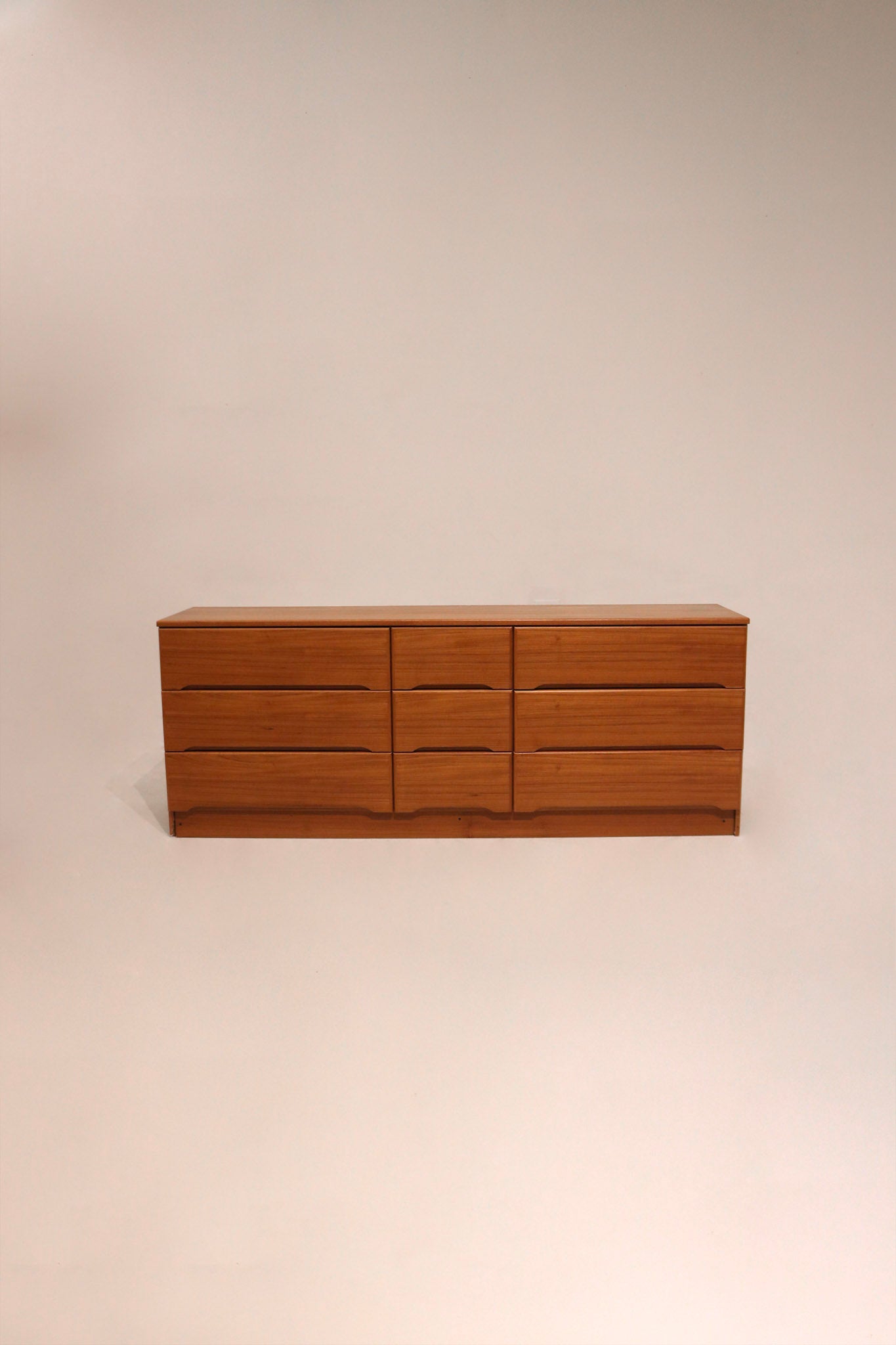 Full view of Vintage Danish MCM Teak Wood 9 Drawers Low Dresser, warm wood tone and minimalist lines