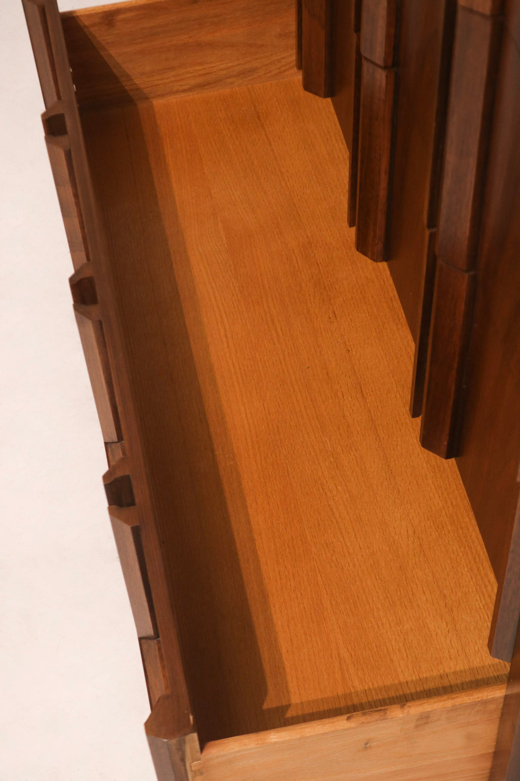 Close-up of wood grain pattern and finish on dresser drawer fronts