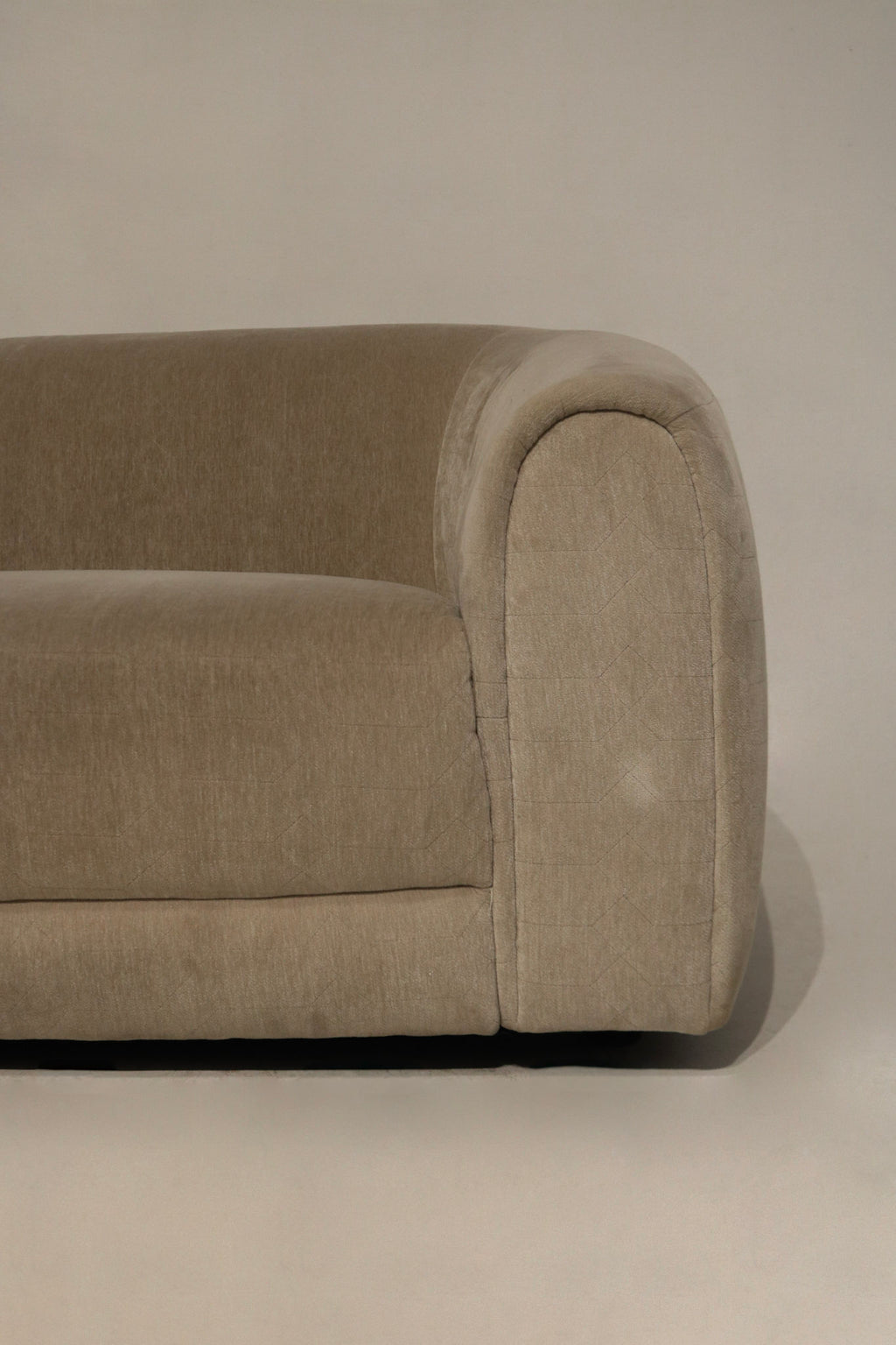 Close-up showing velvet nap and color variation on champagne fabric, highlights soft texture, subtle light reflection and minor surface wear