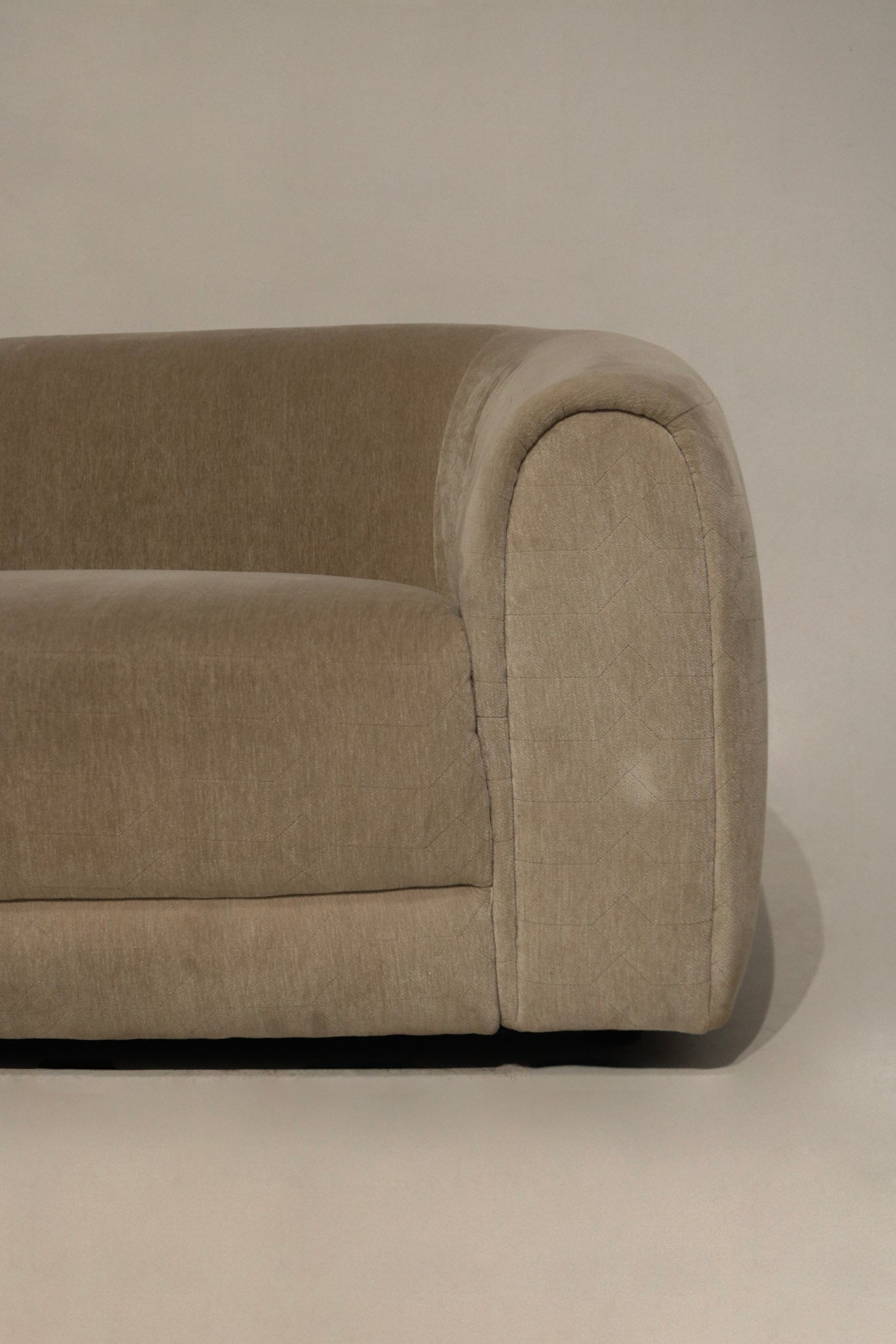Close-up showing velvet nap and color variation on champagne fabric, highlights soft texture, subtle light reflection and minor surface wear