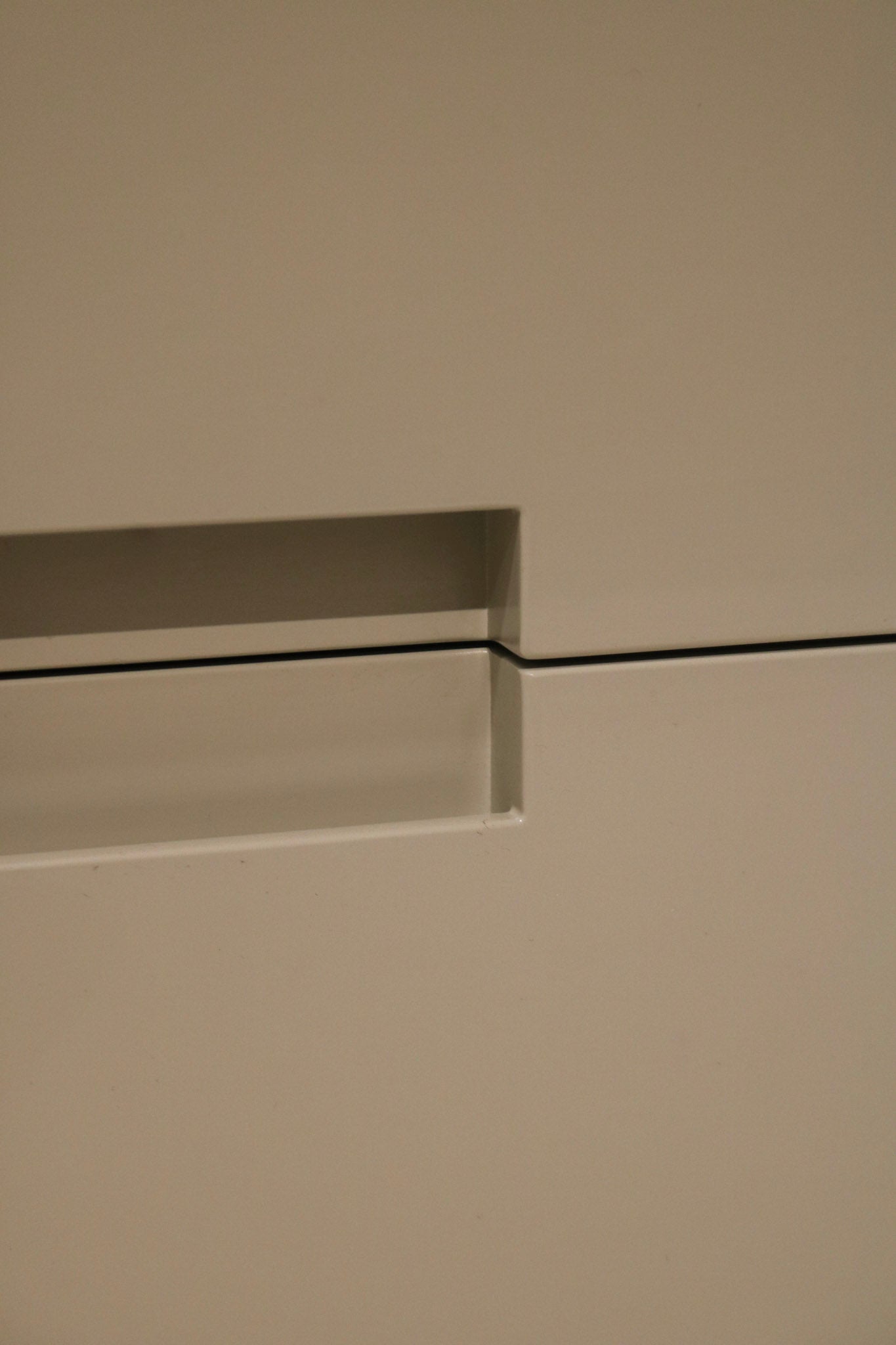 Detail of dresser’s drawer with pink marks inside illustrating interior condition