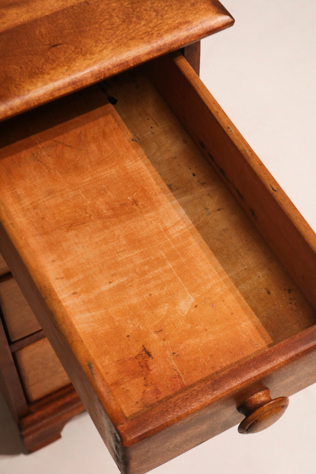 View from above with drawers closed exhibiting clean lines and natural wood tone