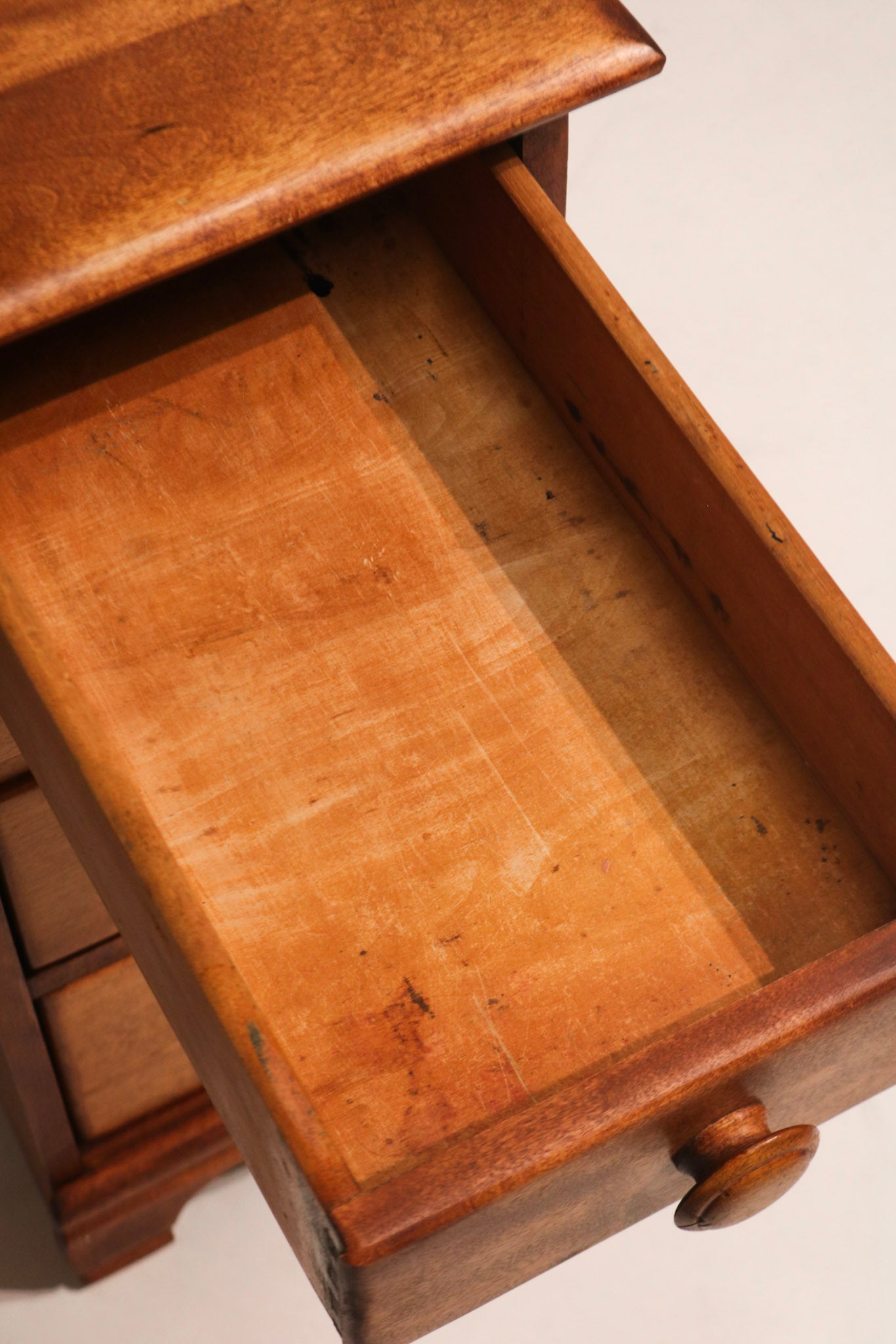 View from above with drawers closed exhibiting clean lines and natural wood tone