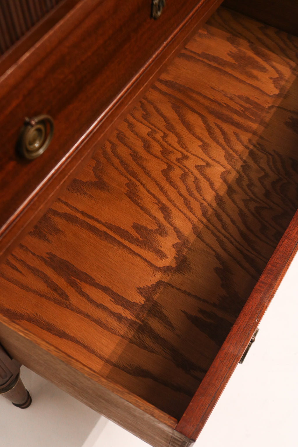 Angled view of dresser accentuating taller height and symmetrical drawer layout