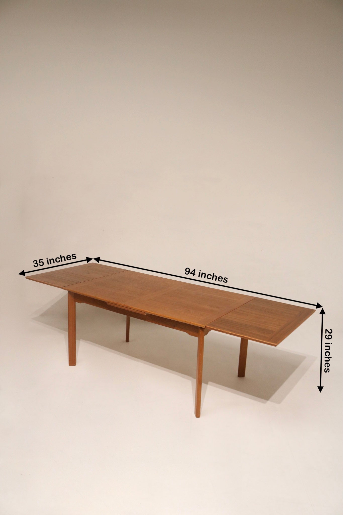 Mid-Century teak dining table with draw leaves
