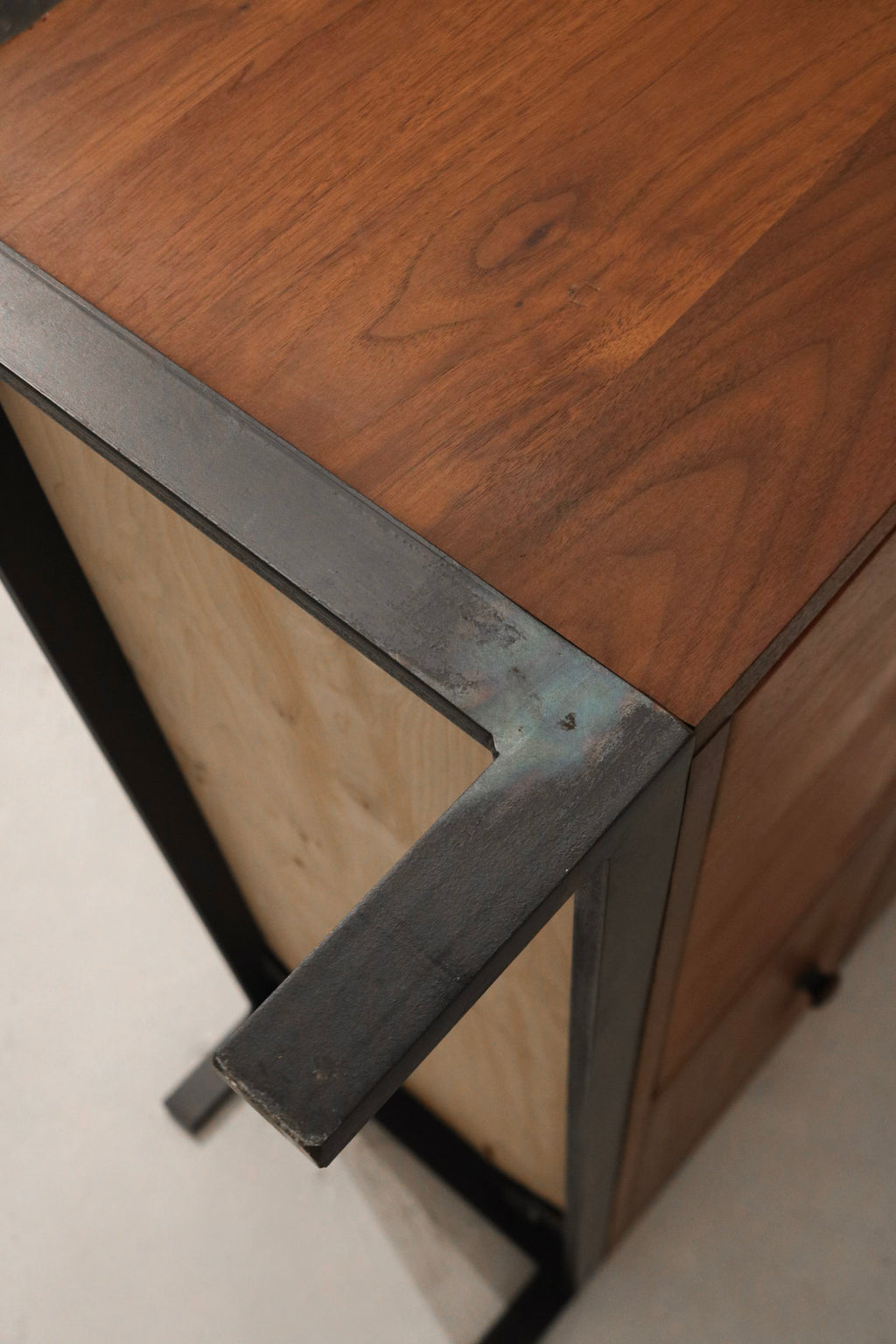 Edge view showing joinery and construction details on walnut panels