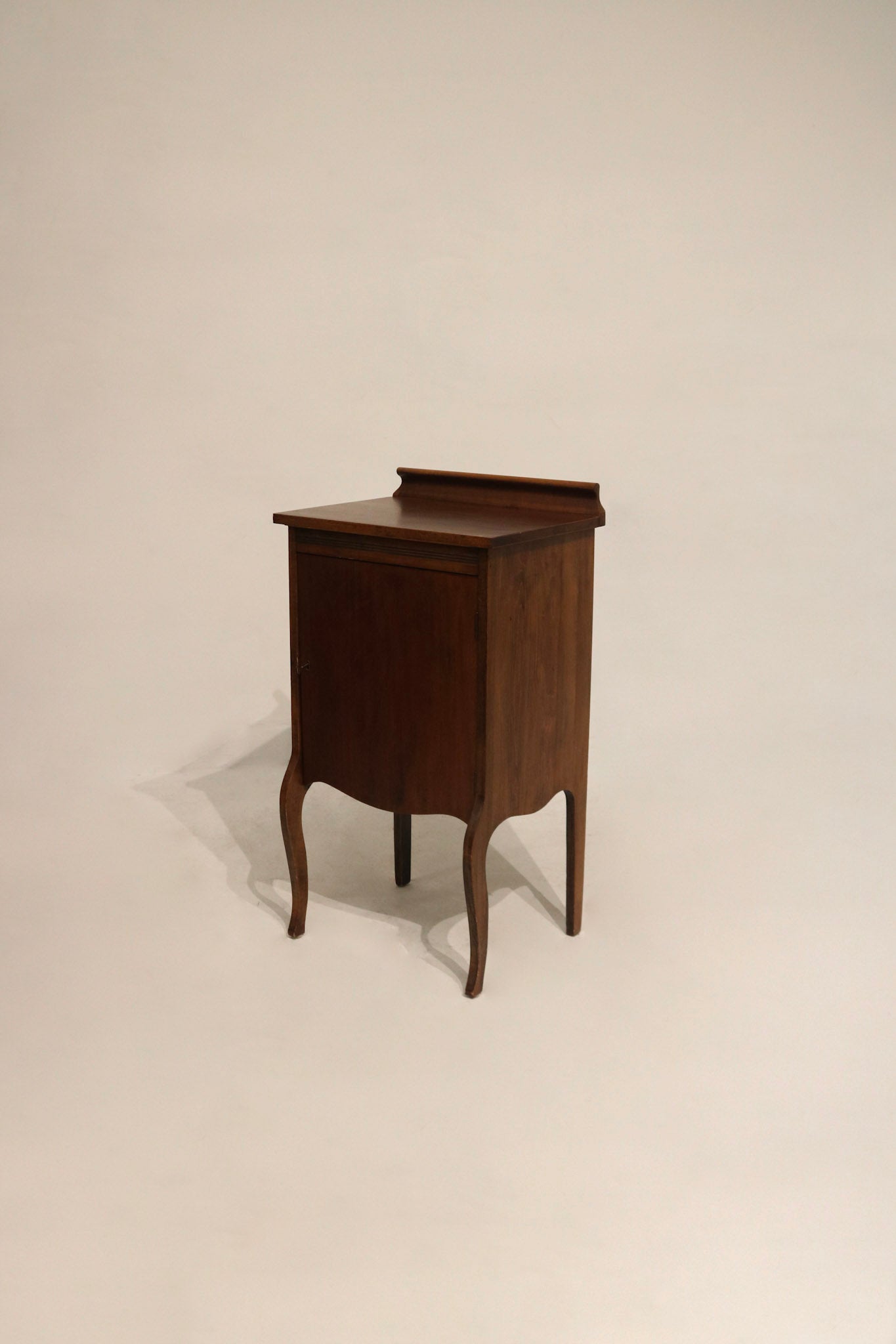 Full view of vintage solid wood bedside cabinet with aged patina, single drawer and cabinet door, size 20in x 15in x 34in