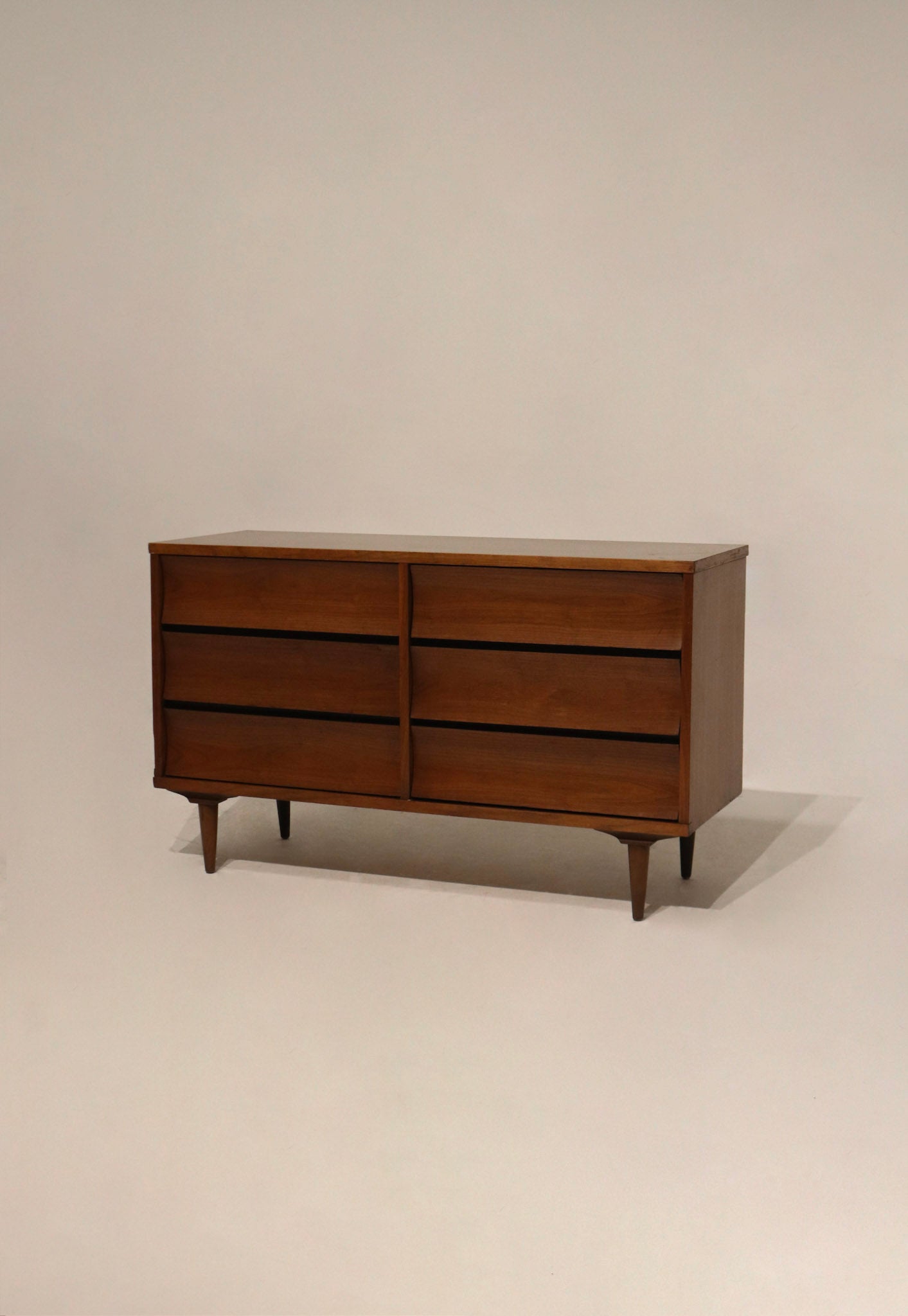 Full front view of Mcm vintage walnut wood small dresser with six drawers, solid wood frame and stained veneer top, restored finish visible