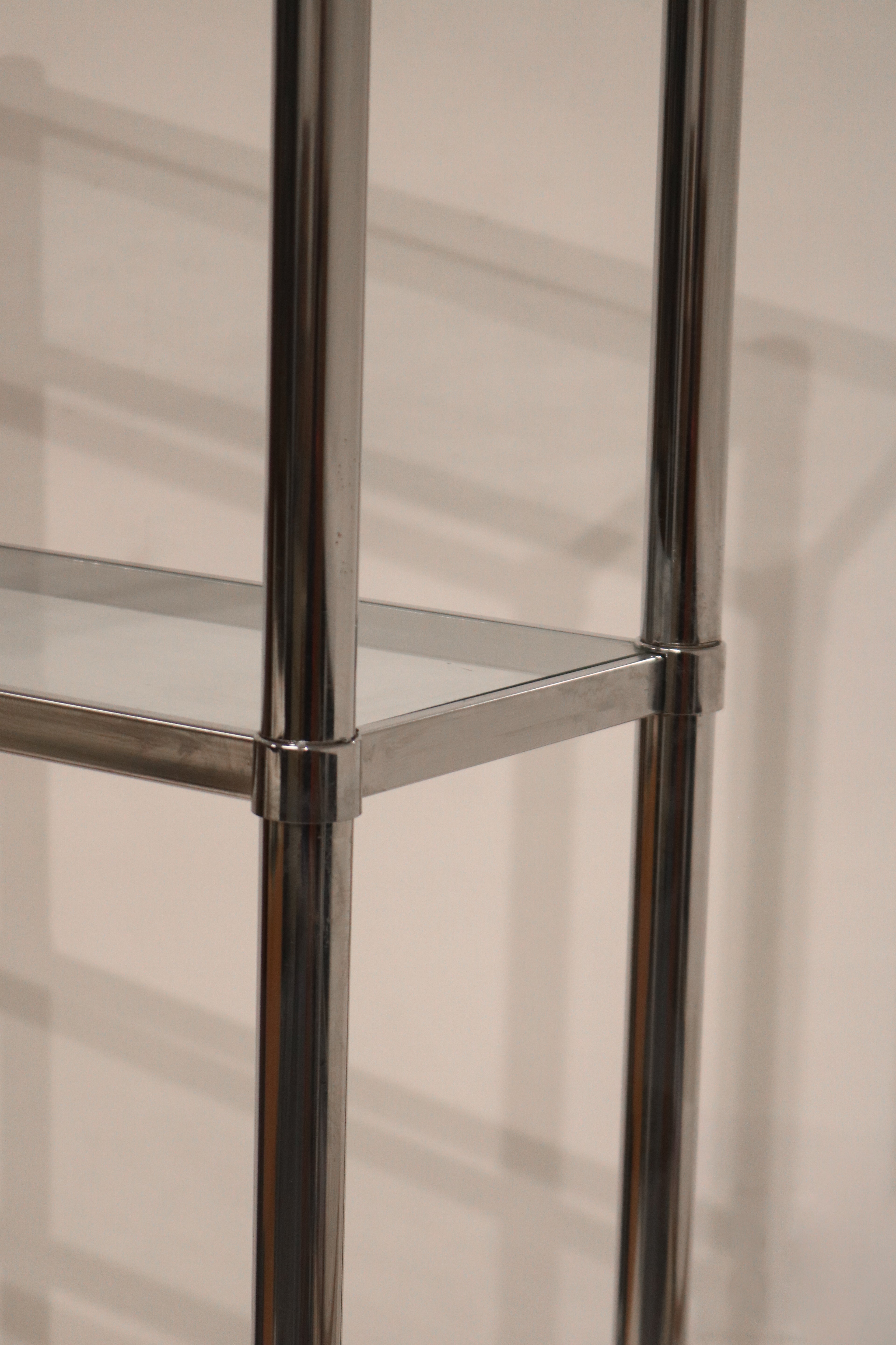 Top corner detail of the Vintage Mcm Chrome Bookcase highlighting sleek chrome finish