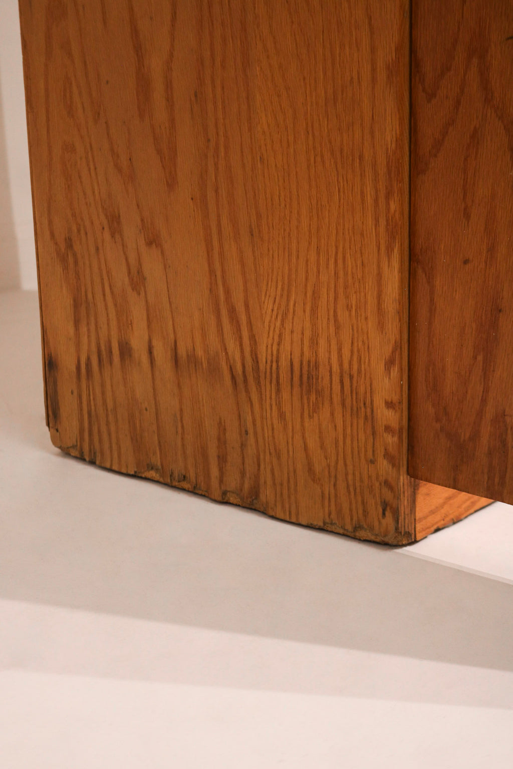 Close-up of oak wood grain and natural finish on the adjustable shelves of Mcm tall bookcase