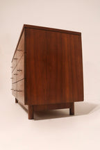 Side profile of dresser showing slim elegant lines and low height typical of mid-century modern style