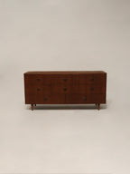 Front angled view of Mid Century Modern walnut wood dresser with 8 drawers by Bassett Furniture