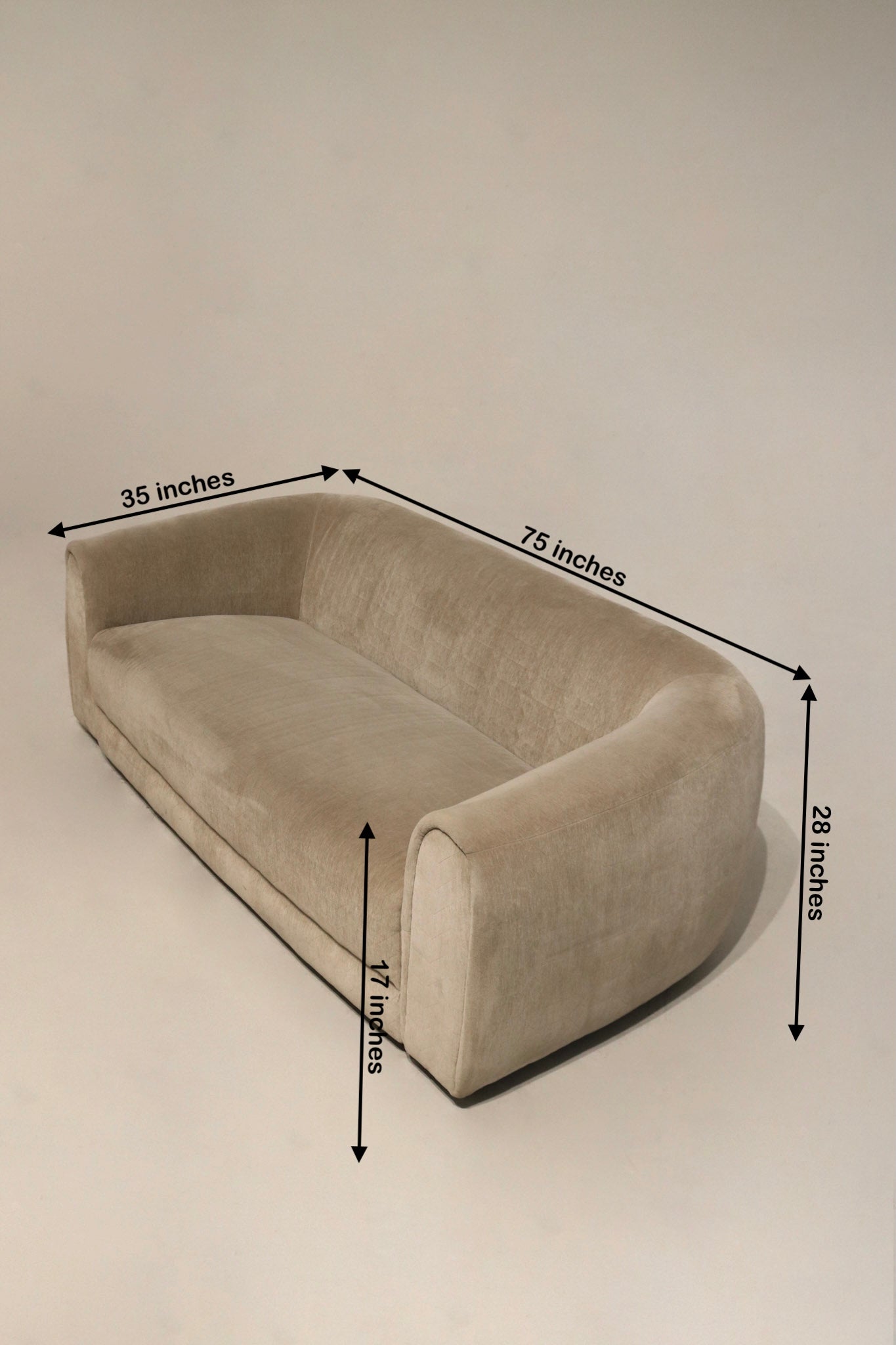 Dimension diagram showing 75 in L x 35 in D x 28 in H with seat height 17 in, champagne velvet fabric, ideal sizing for NYC living spaces