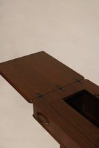 Detail: left leaf extended view of walnut wood side table, fold-out leaf open to expand workspace, showing grain and edge profile