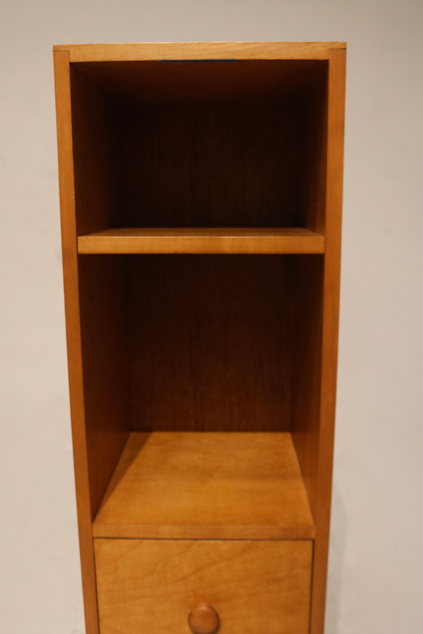Back panel image of tall thin oak bookcase, shows overall vertical design