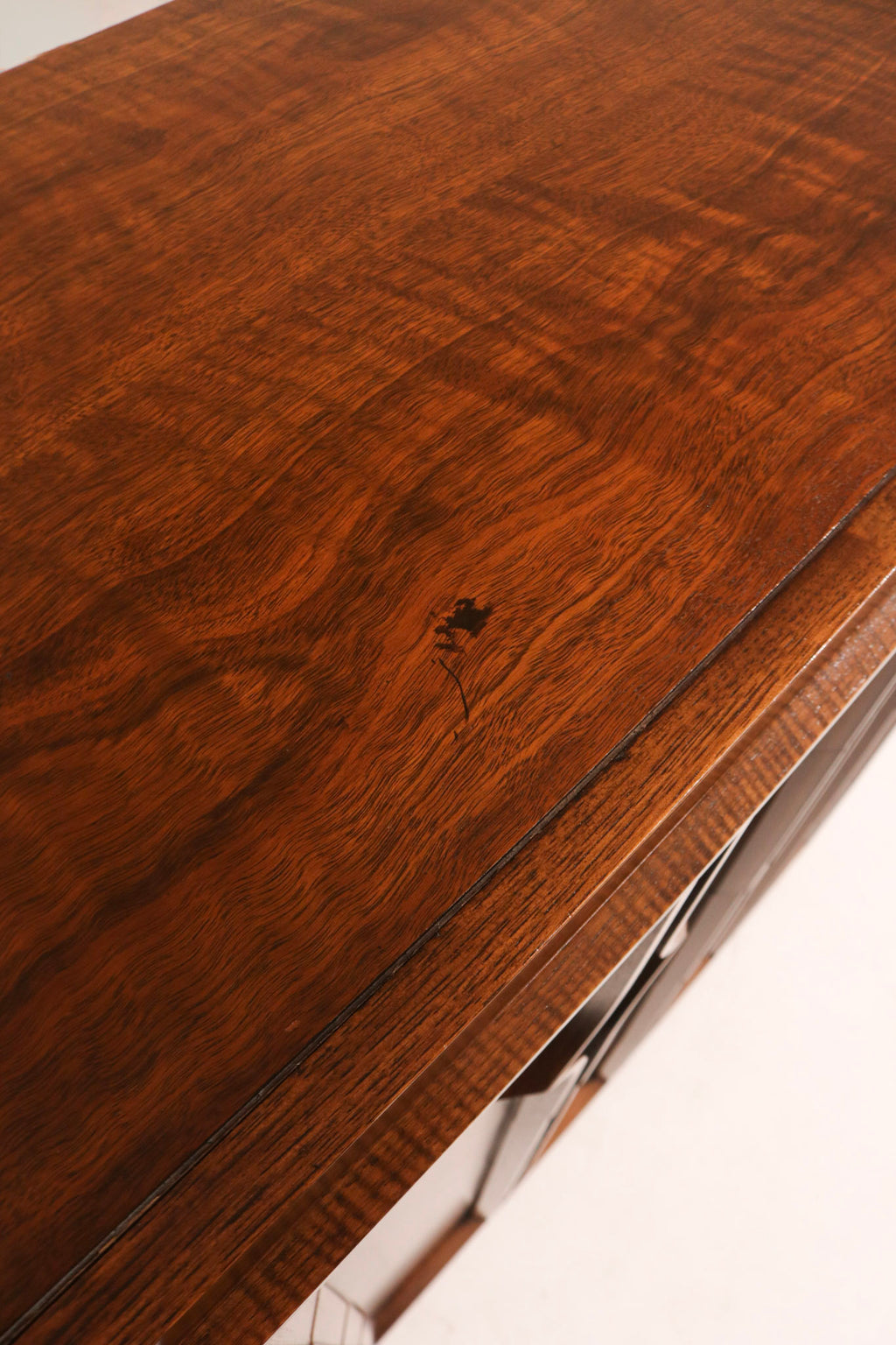 Perspective shot emphasizing vertical design and spacious storage of solid wood vintage dresser