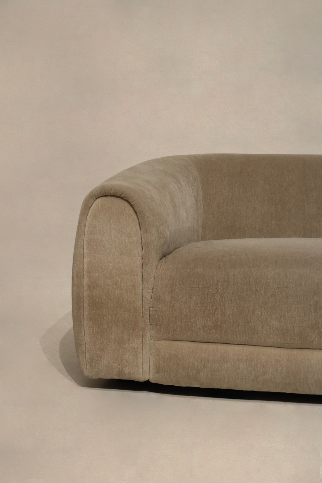 Detail of seat cushion depth and alignment on champagne velvet sofa, plush seating, minimal sag and clear 17 in seat height for comfortable sit
