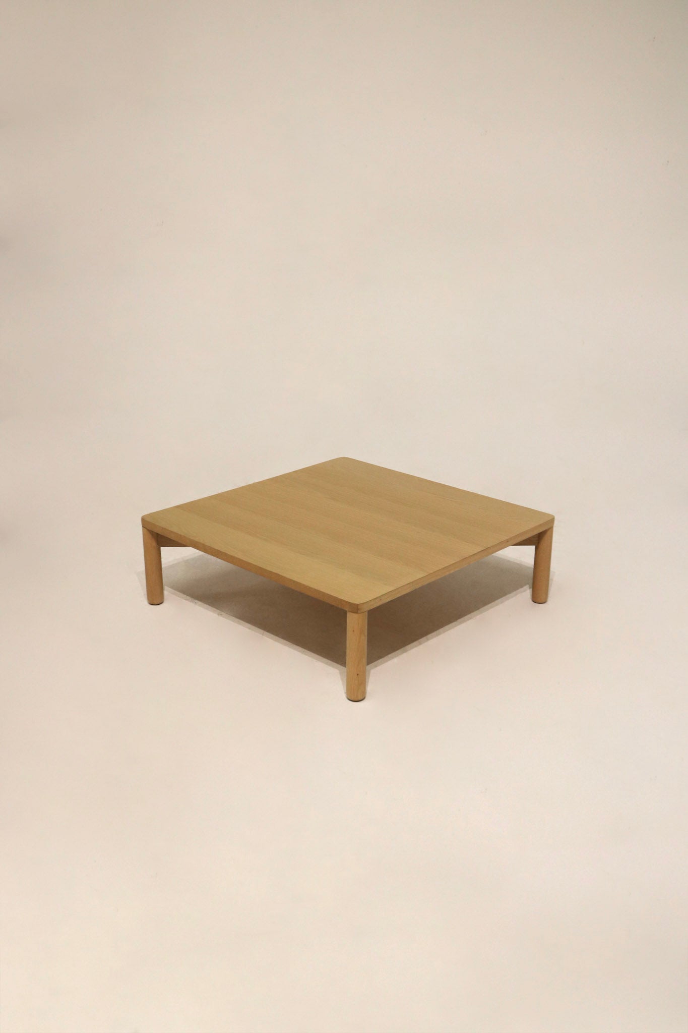 Main view of Modern West Elm low-profile square oak wood coffee table with oak veneer finish, tapered legs, pristine like-new condition