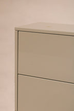 Handle hardware close-up on one drawer, featuring modern metallic finish
