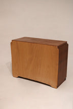 Left side of the dresser chest showing minor scuff near base and wood detail