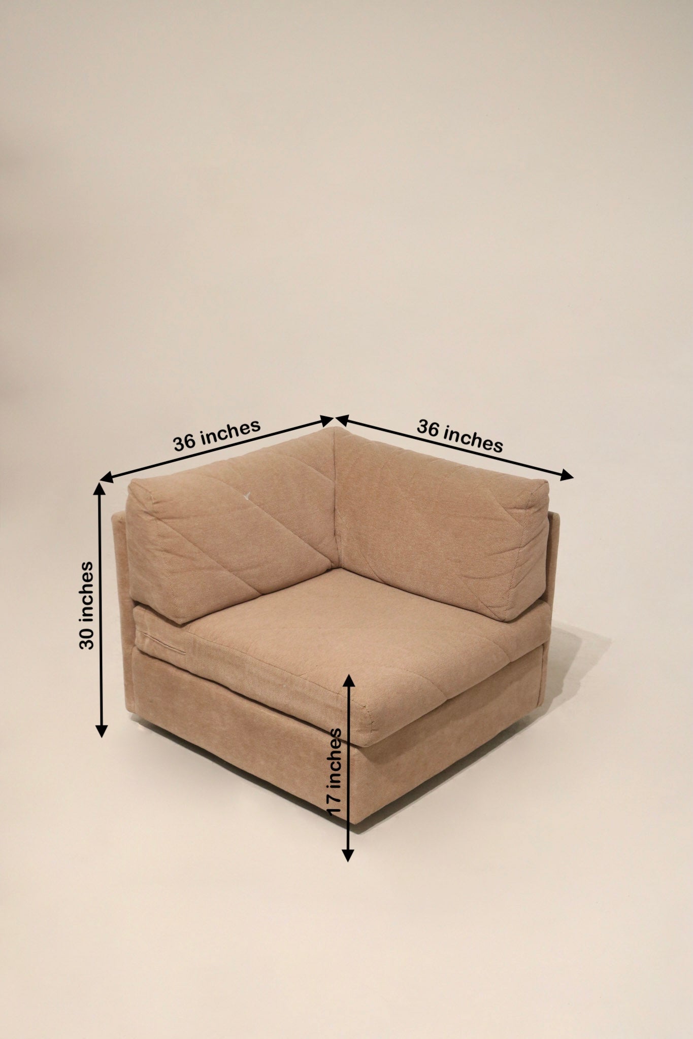 Leg and base detail of Mcm modular sectional fabric sofa revealing wooden/covered base, hardware attachment and low-profile midcentury look