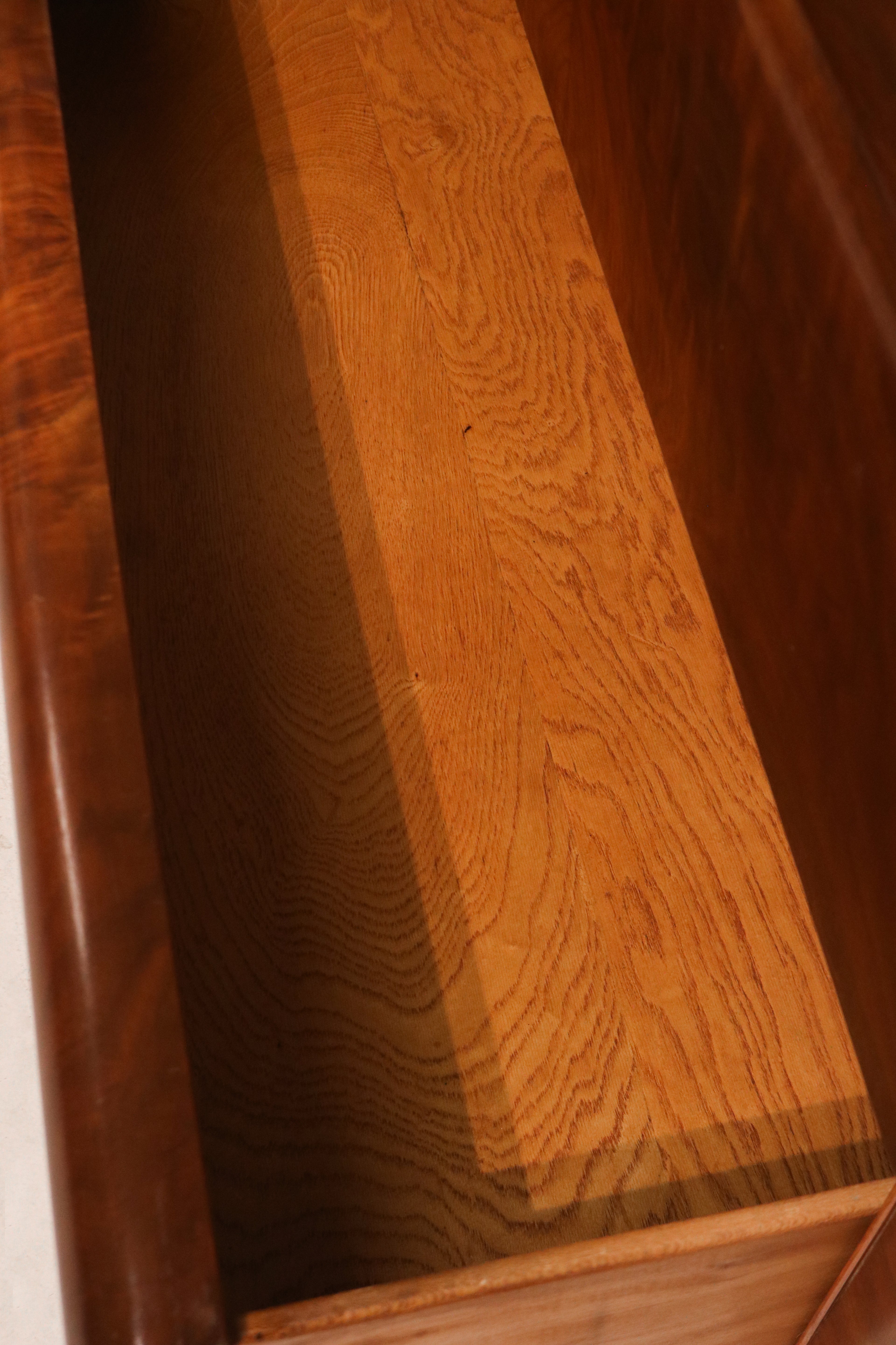 Bottom view showing vintage legs and solid base of the wooden dresser chest