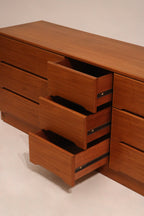 Underside of the dresser showing leg joints and base support in solid teak wood
