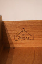 View of hardware showing original mid-century brass pulls on walnut drawers