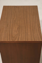 Side view showing profile of walnut body and elegant craftsmanship