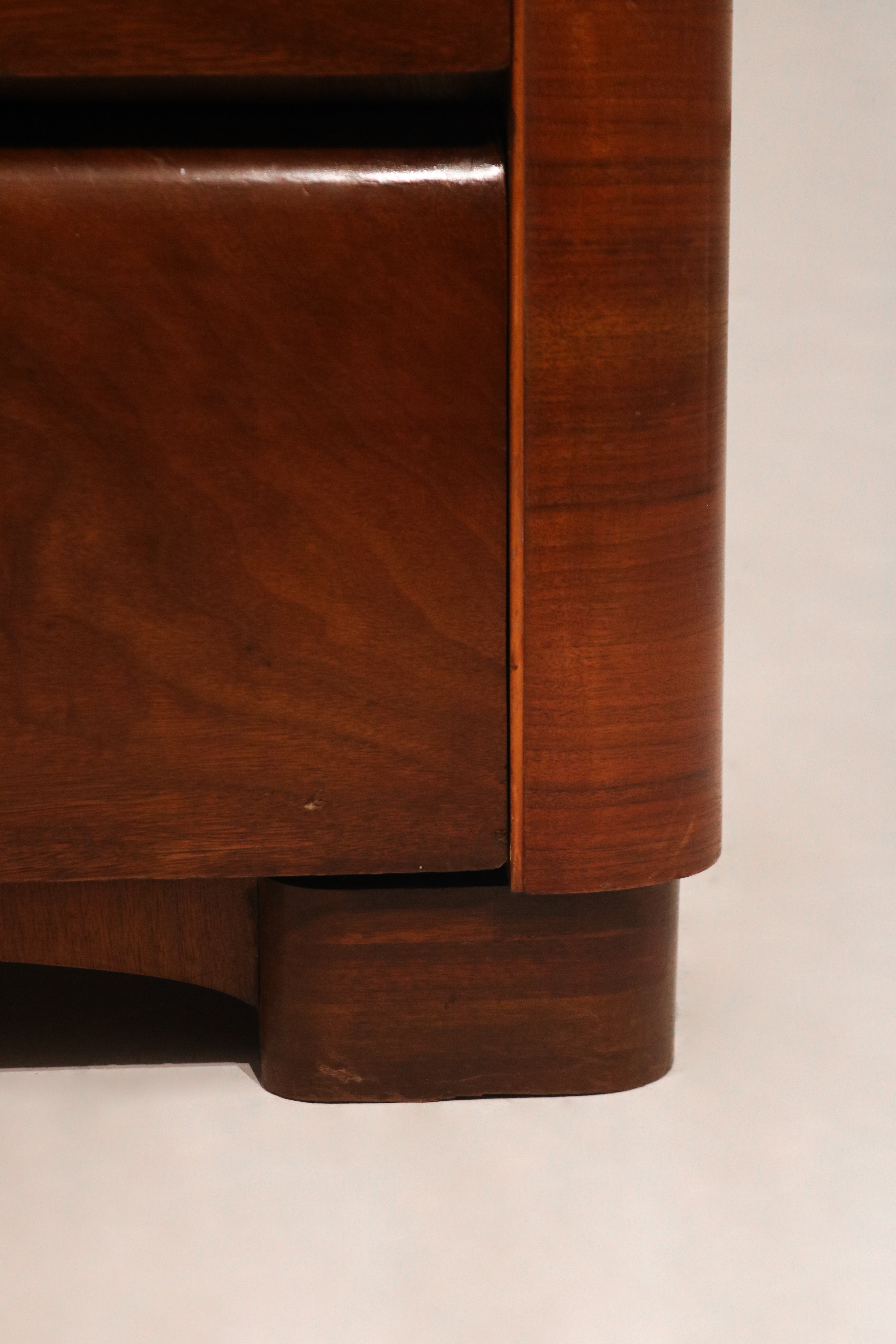 Detail of dresser drawer handle and wooden hardware in vintage brass finish