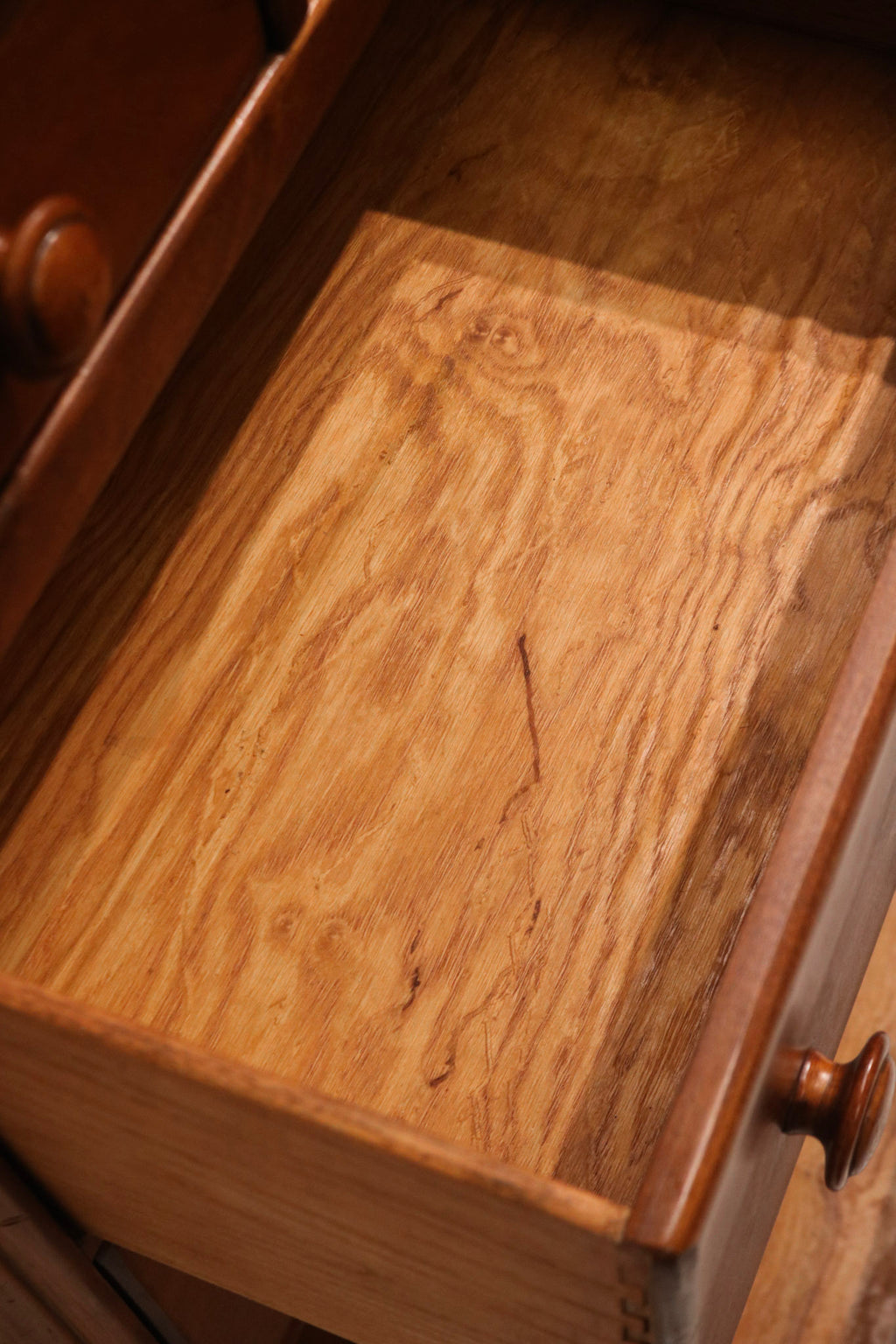 Detailed view of dresser side panels in solid maple wood with no blemishes