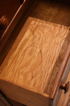 Detailed view of dresser side panels in solid maple wood with no blemishes