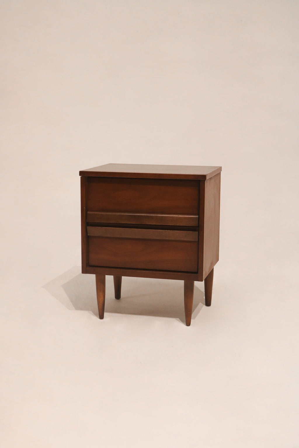 Main view of MCM vintage walnut wood nightstand with two drawers in excellent condition