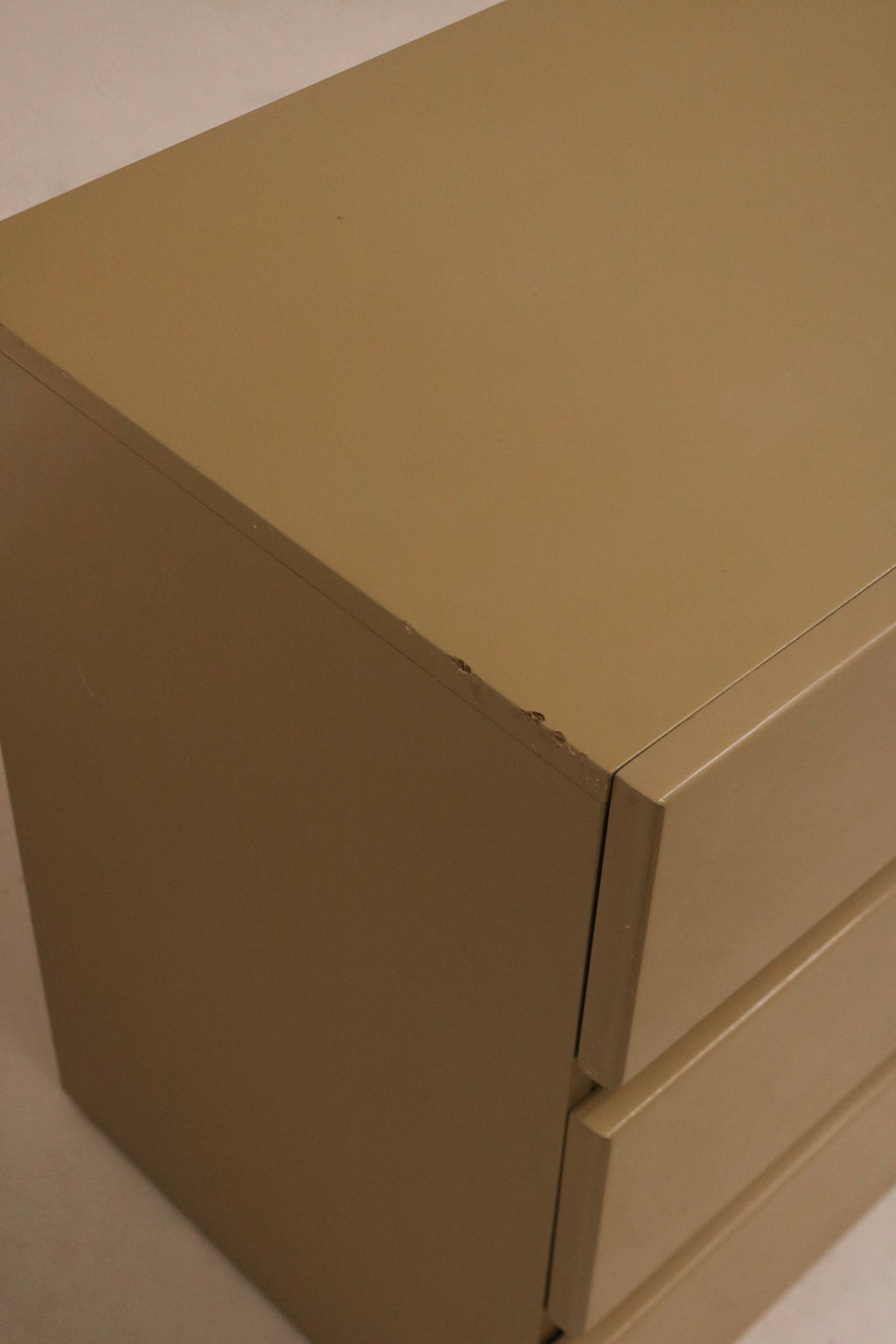 Close-up of bottom drawer glide showing smooth mechanics and vintage wood joints
