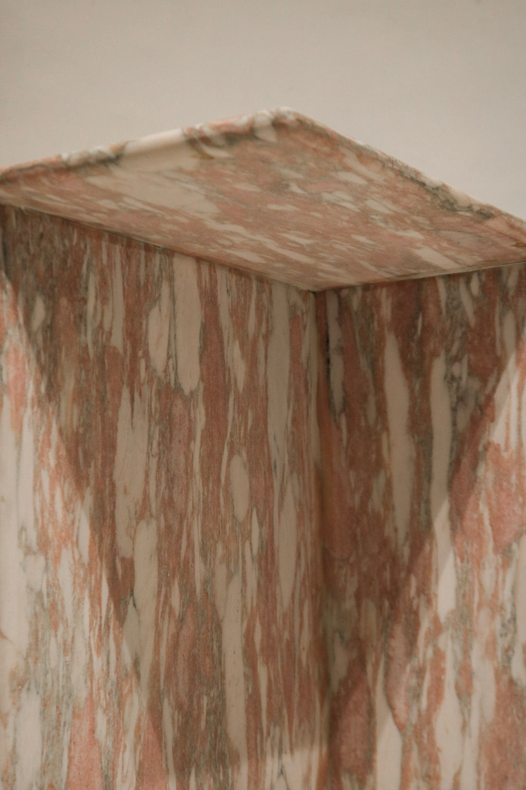 View focused on base and weighty construction, solid natural marble support and sturdy contemporary design for small NYC spaces.