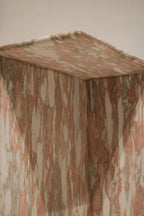 View focused on base and weighty construction, solid natural marble support and sturdy contemporary design for small NYC spaces.