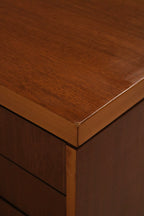 Angled view capturing depth and profile of the credenza's body and metal base